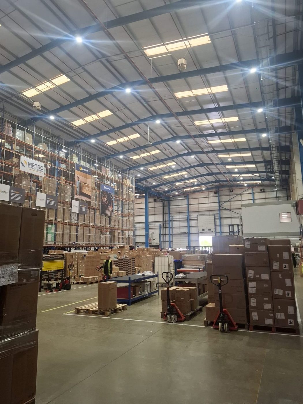 Metro Supply Chain warehouse interior with workers, cleaned and maintained by Eastrada