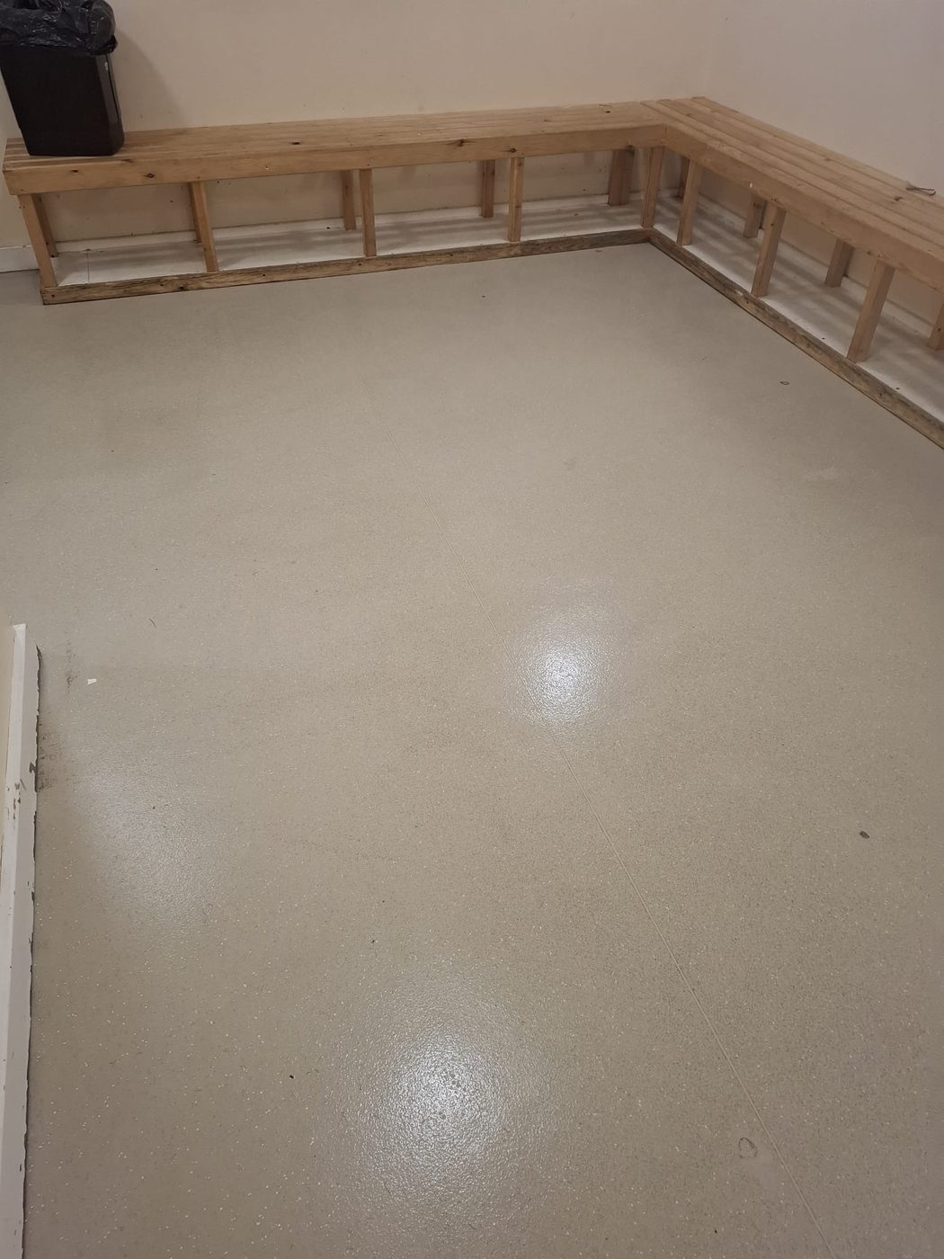 Freshly deep-cleaned changing room floor at Needham Market FC with restored non-slip finish