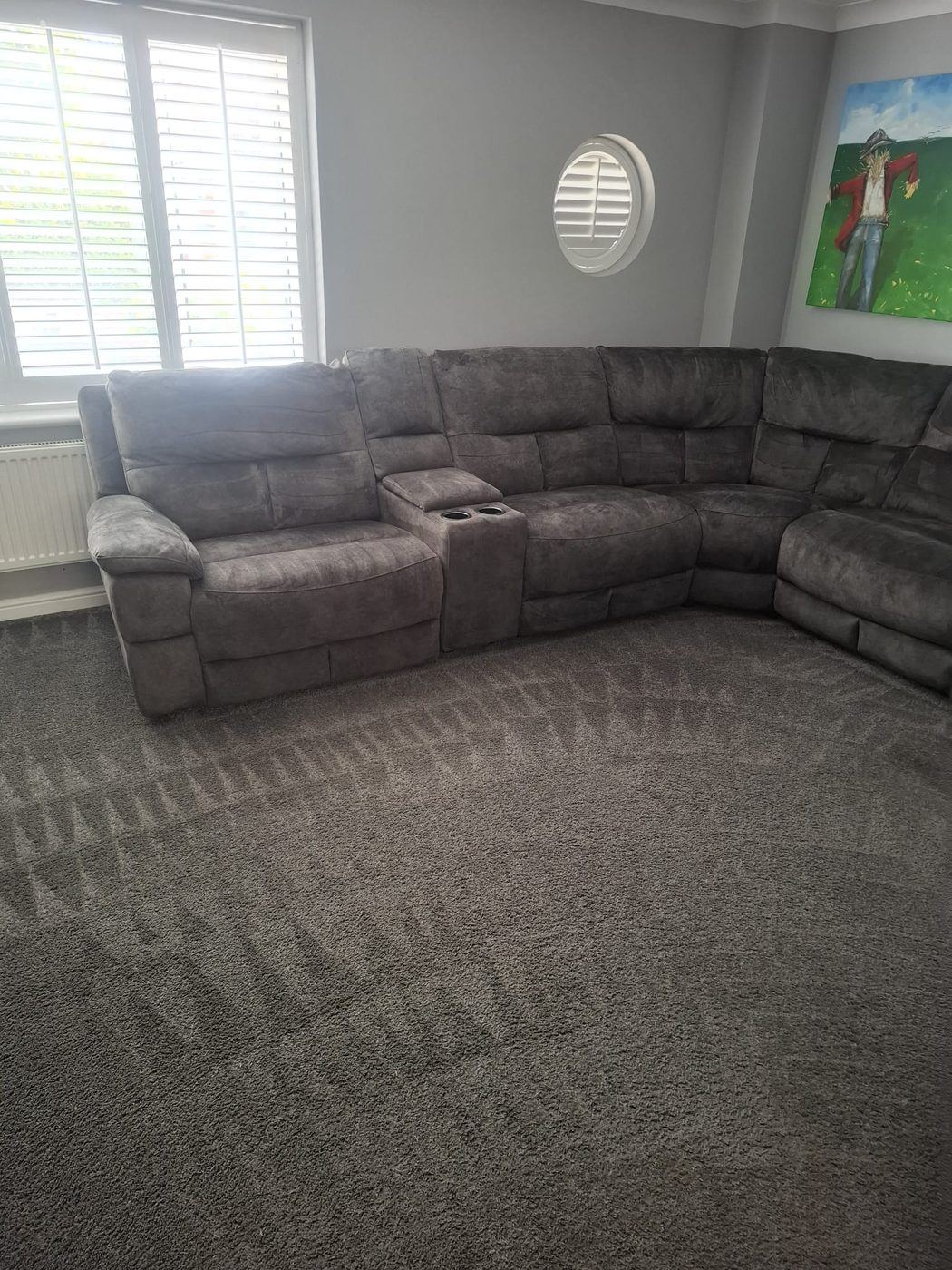 Large fabric corner sofa and carpet cleaned by hot water extraction in a family living room